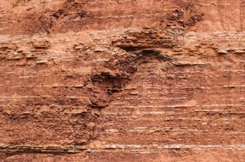 Red sedimentary clay background eroding Stock Photos