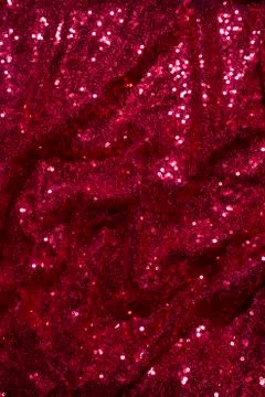 Red Sequined Material for Clothes. Background texture with shiny, small elements Stock Photos