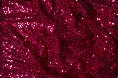 Red Sequined Material for Clothes. Background texture with shiny, small elements Stock Photos