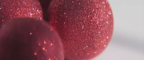 Red sequins on Christmas ball 4K anamorphic sliding video Stock Footage 316876512