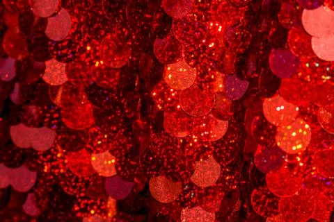 Red sequins pattern. Sparkling sequins background. Red sequin fabric for back Foto stock