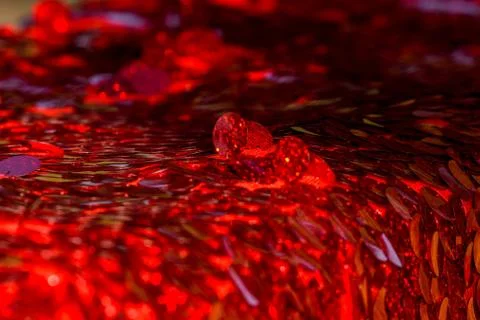 Red sequins pattern. Sparkling sequins background. Red sequin fabric for back Foto stock