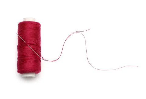 Red sewing thread with needle on white background Stock Photos