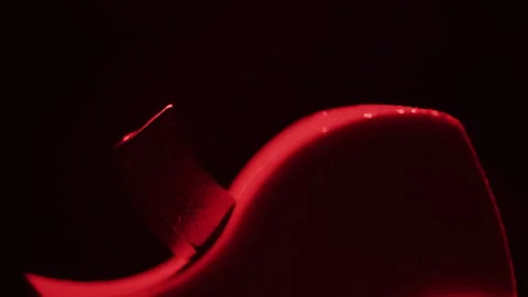 Red shape moving in the dark Stock Footage 255682219