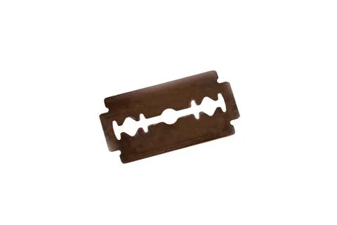 Red sharp blade for a razor on a white background Foto stock