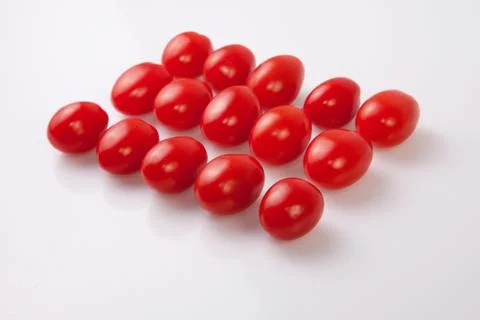Red shiny cherry tomatoes Stock Photos
