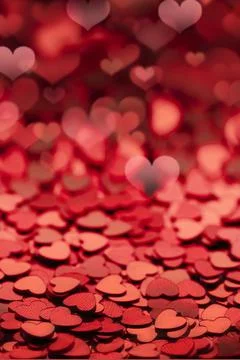 Red shiny empty background of confetti hearts blur. it is suitable for creating Stock Photos