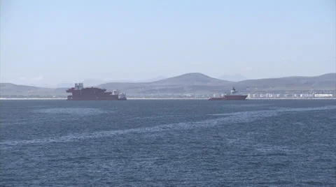 Red Ship and barge being towed in Cape Town Stock Footage 37758101