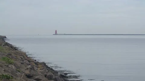 Red ship in front of Poolbeg Lighthouse Video stock 170891021