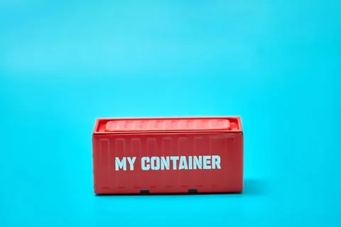 Red Shipping Container on Blue Background Photos