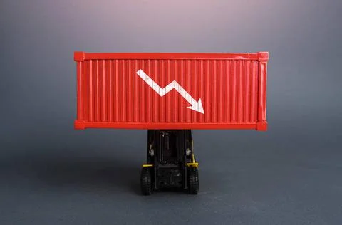Red shipping container with down arrow. Decrease in imports and exports of... Stock Photos