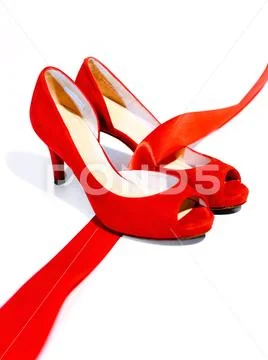 Red shoes, a symbol femicide. Illustrative editorial Stock Photos