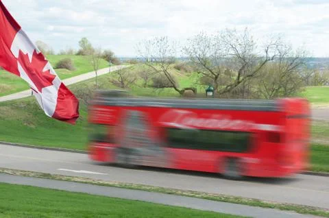 Red sightseeing double deck bus in motion in Quebec city, Canada Stock Photos