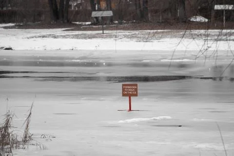 Red sign dangerously thin ice without inscription Snowtime danger red Stock Photos