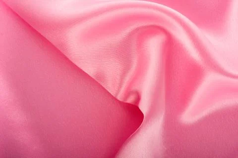 Red silk fabric with waves. Stock Photos