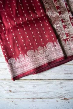 Red silk sari on a background. Stock Photos