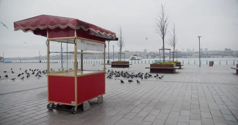 Red Simit Booth in Empty Üsküdar Pier Square due to Covid-19 Pandemic Curfew Stock Footage 153286455