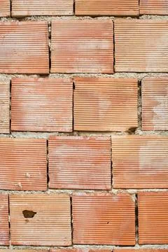 Red simple brick masonry Red simple brick masonry background with lined te... Stock Photos