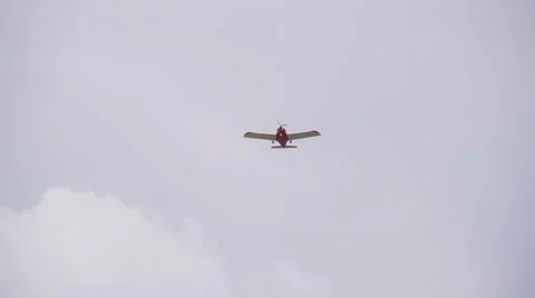 Red single engine private plane flying overhead Stock Footage 53352164