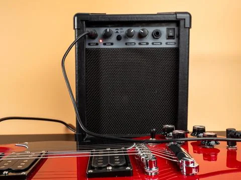 Red six-string electric guitar. Stock Photos