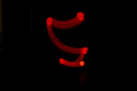 Red skull on black background / light painting Stock Photos