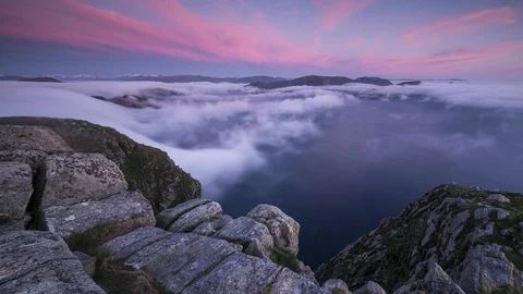 Red sky with inversion flowing over the coastline Stock Footage 122960749