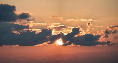 Red sky with sun in clouds Stock Photos