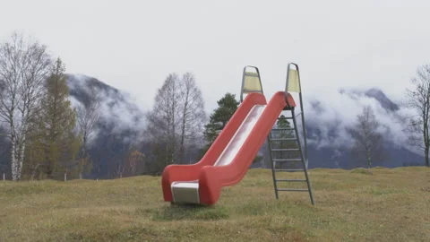 Red slide with Mountains and fast running clouds Stock Footage 220017478
