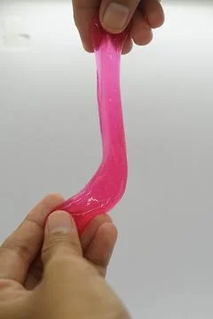 Red slime  on hand Stock Photos