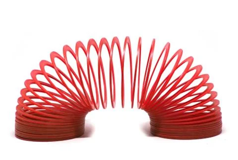 RED slinky spring toy Isolated on white Stock Photos