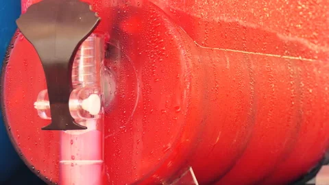 Red slush. Slush puppy machine. Stockbeeldmateriaal 89131679