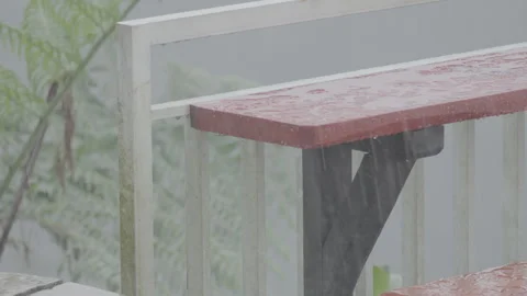 Red Small Table by Fence During Rainy Weather - S Log 3 Video stock 306193506