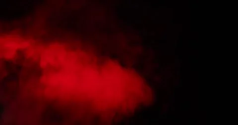 Red smoke on black background in the center of the frame Stock Footage 318294123