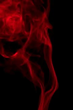 Red smoke on black background Photos