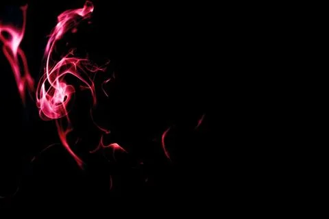 Red smoke on black background Stock Photos