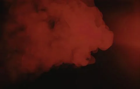 Red smoke cloud on black background Stock Photos