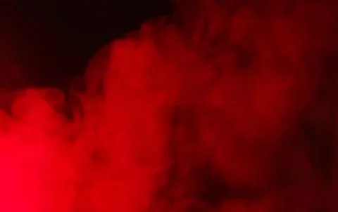 Red smoke cloud in dark background Stock Photos