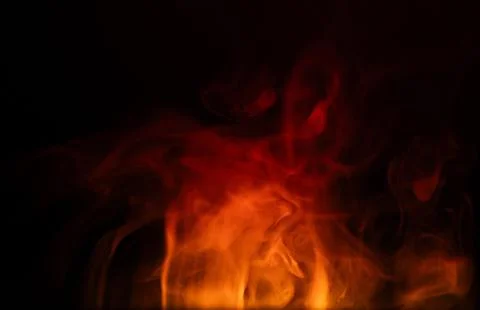 Red smoke effect. Realistic smoke with different colors on black background. 스톡 사진