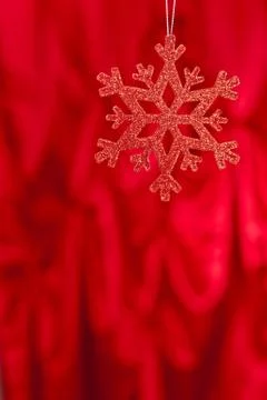 Red snow flake on a red background Stock Photos