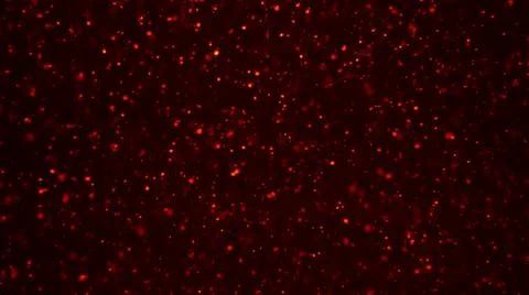 Red snow particles bokeh texture background. Sparkling particles for Christmas Stock Photos