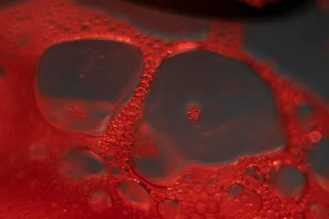 Red Soap Bubbles on a Piece of Plastic or Blood Petri Dish Effect Foto stock