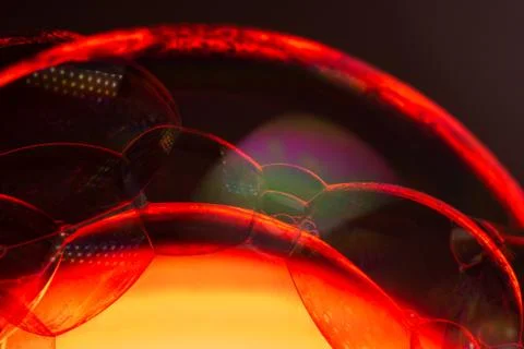 Red soap bubbles with a red core like the sun Stock Photos