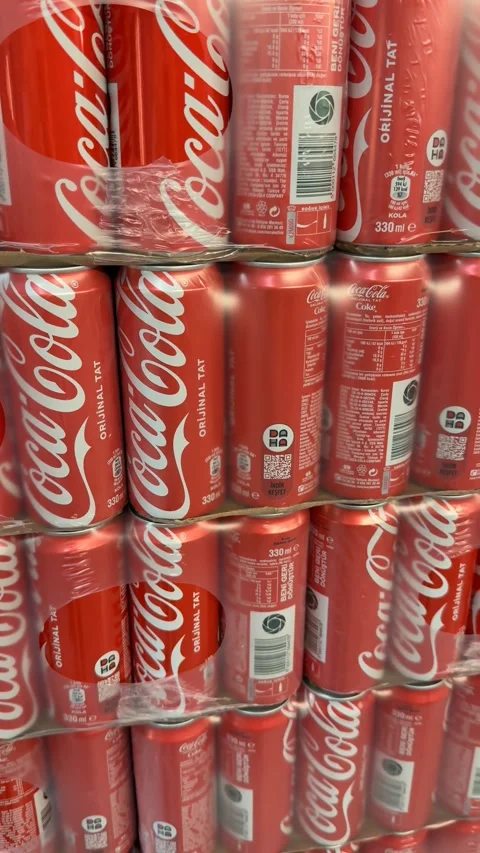 Red soda cans stacked in a vertical format create a vibrant background with.. Stock Footage 336398704