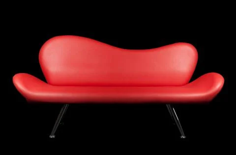 Red sofa on black background Stock Photos