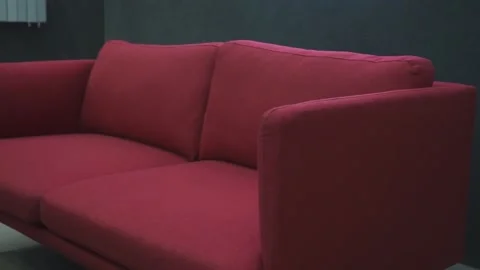 The red sofa for two people does not fold out Stock Footage 274500001