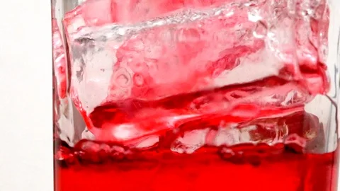 Red soft drink's bubble in a glass. Stock Footage 117973838