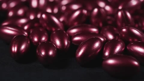 Red softgels capsules of vitamins on dark background. Stock Footage 300345603