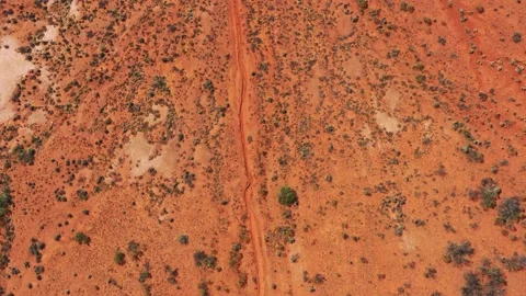 From Red soil of Australian outback desert up to blue sky horizon – aerial 4k Stock Footage 168163407