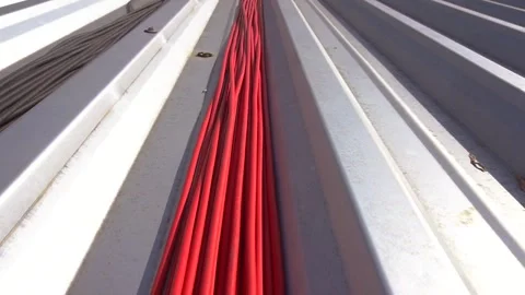 Red solar panel cables. Span over a bundle of cables. Stock Footage 347618143