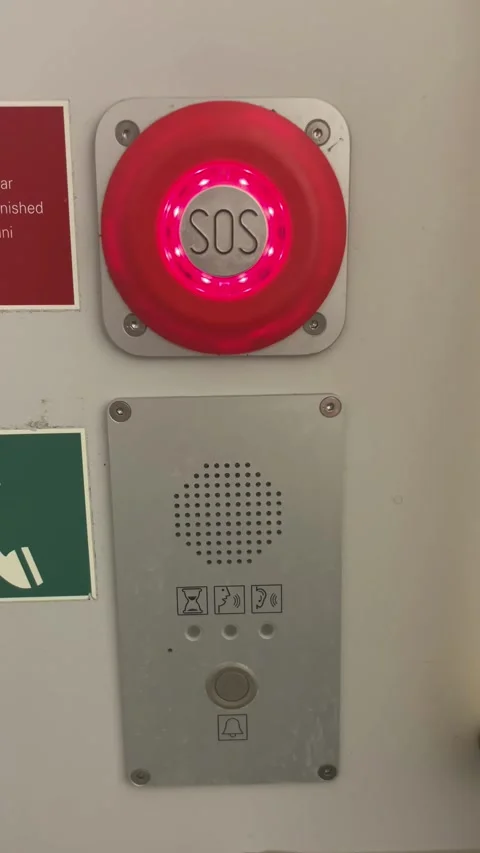 Red SOS alarm button with speaker panel on wall Stock Footage 348281827